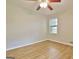 Bedroom featuring wood-look floors and window at 260 Sharon Dr, Fayetteville, GA 30214