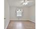 Bright bedroom featuring a ceiling fan and wood flooring at 260 Sharon Dr, Fayetteville, GA 30214