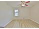 Bedroom with wood-look floors and window at 260 Sharon Dr, Fayetteville, GA 30214