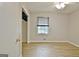 Bright bedroom features stylish wood flooring and a ceiling fan at 260 Sharon Dr, Fayetteville, GA 30214