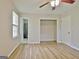 Bedroom features wood-look floors, bathroom access, and closet at 260 Sharon Dr, Fayetteville, GA 30214