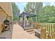 View of deck with gazebo and grill area next to brick home, ideal for outdoor gatherings at 260 Sharon Dr, Fayetteville, GA 30214