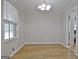 Bright dining room featuring a large window and simple modern chandelier at 260 Sharon Dr, Fayetteville, GA 30214