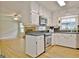 Bright kitchen featuring white cabinetry, stainless steel appliances and granite countertops at 260 Sharon Dr, Fayetteville, GA 30214