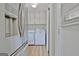 Compact laundry area featuring a modern washer, dryer, and storage cabinets at 260 Sharon Dr, Fayetteville, GA 30214