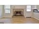 Inviting living room with a brick fireplace, window and door with lots of natural light at 260 Sharon Dr, Fayetteville, GA 30214