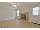 Bright living room features a brick fireplace and access to a side yard at 260 Sharon Dr, Fayetteville, GA 30214