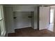 Bedroom with carpet, a window with bright light, and a built-in closet at 250 Jonesboro Rd, Jonesboro, GA 30236