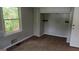 Bedroom with carpet, a window with bright light, and a built-in closet at 250 Jonesboro Rd, Jonesboro, GA 30236