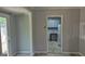 Bright dining area with access to the kitchen and a sliding glass door leading to outdoor at 250 Jonesboro Rd, Jonesboro, GA 30236