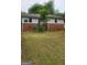 Charming one-story home featuring a brick facade, well-tended lawn and mature trees at 250 Jonesboro Rd, Jonesboro, GA 30236