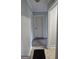 Hallway with neutral paint and carpeting connecting several rooms in the home at 250 Jonesboro Rd, Jonesboro, GA 30236