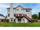 Backyard with a lawn, fence, basement door, and elevated deck and stairs at 980 Charter Club, Lawrenceville, GA 30043