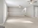Finished basement with neutral walls, plush carpet and recessed lighting at 980 Charter Club, Lawrenceville, GA 30043