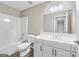 Bathroom featuring a tub and shower combination, a white vanity, and modern fixtures at 980 Charter Club, Lawrenceville, GA 30043