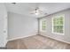 Bedroom with plush carpet, ceiling fan and two windows with blinds at 980 Charter Club, Lawrenceville, GA 30043