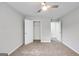 Bedroom featuring a ceiling fan, wall to wall carpeting, closet, and neutral walls at 980 Charter Club, Lawrenceville, GA 30043