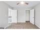 Bedroom featuring neutral walls and carpet with two closets and access to the landing and stairs at 980 Charter Club, Lawrenceville, GA 30043