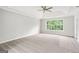 Bedroom featuring a ceiling fan, large window, and wall to wall carpeting at 980 Charter Club, Lawrenceville, GA 30043