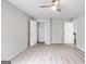 Neutral bedroom featuring carpet flooring, ceiling fan, closet and an entry door at 980 Charter Club, Lawrenceville, GA 30043