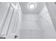 Walk-in closet with wire shelving, a light, and a white painted door at 980 Charter Club, Lawrenceville, GA 30043