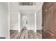 Inviting foyer featuring wood-look flooring and a view of the home's layout at 980 Charter Club, Lawrenceville, GA 30043