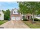 Charming brick home with well manicured landscaping, two-car garage and beautiful curb appeal at 980 Charter Club, Lawrenceville, GA 30043