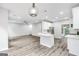 Modern open concept kitchen featuring an island and an open view to the living room at 980 Charter Club, Lawrenceville, GA 30043