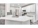 Modern kitchen with white cabinets, stainless steel appliances, and quartz countertops at 980 Charter Club, Lawrenceville, GA 30043