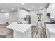 Modern kitchen featuring stainless steel appliances, an island with a sink, and ample counter space at 980 Charter Club, Lawrenceville, GA 30043