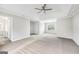 Spacious main bedroom features a tray ceiling, carpet, and ensuite bathroom at 980 Charter Club, Lawrenceville, GA 30043