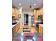 Functional kitchen showcasing light wood cabinetry, stainless steel appliances, and hardwood flooring at 223 Overland Trl, Mcdonough, GA 30252