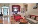 Open-concept living room showcases hardwood floors, comfortable furniture, and inviting decor at 223 Overland Trl, Mcdonough, GA 30252