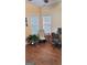 Bright living room with hardwood floors, large windows, and comfortable seating at 223 Overland Trl, Mcdonough, GA 30252