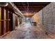 Large unfinished basement area with concrete floors, cinder block walls, and an open floorplan ready for finishing at 115 Fernway Dr, Fayetteville, GA 30214