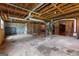 Spacious unfinished basement with exposed beams, duct work, and block walls ready for customization at 115 Fernway Dr, Fayetteville, GA 30214