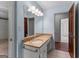 Light filled bathroom with updated vanity, neutral paint and tile flooring at 115 Fernway Dr, Fayetteville, GA 30214