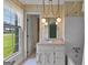 Bathroom with vintage wallpaper, white fixtures, and a view of the outdoors at 115 Fernway Dr, Fayetteville, GA 30214
