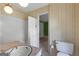 Vintage bathroom with white tile, shower-tub combo, pink marble counter at 115 Fernway Dr, Fayetteville, GA 30214