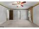 Neutral bedroom featuring carpet, ceiling fan, and an abundance of natural light at 115 Fernway Dr, Fayetteville, GA 30214