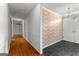 Entry Foyer with hardwood floors and decorative wallpaper at 115 Fernway Dr, Fayetteville, GA 30214