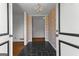 Charming foyer with decorative wallpaper and chandelier, leads to spacious rooms at 115 Fernway Dr, Fayetteville, GA 30214