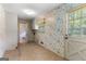 Cozy laundry room featuring tile flooring and a door with exterior access at 115 Fernway Dr, Fayetteville, GA 30214