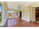 Sunroom with brick accent wall, tile flooring, and multiple windows at 115 Fernway Dr, Fayetteville, GA 30214