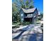 Beautiful modern two-story home with dark siding, sleek lines and a well-maintained lawn on a sunny day at 1225 Bridges Sw Ave, Atlanta, GA 30310