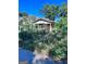 Exterior shot of a dilapidated single-story home with an overgrown yard needing significant renovation at 1225 Bridges Sw Ave, Atlanta, GA 30310