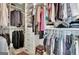 Walk-in closet featuring ample storage with built-in shelves, drawers, and hanging rods for clothing at 332 Aster Ridge Trl, Peachtree City, GA 30269