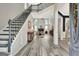 Spacious foyer with hardwood floors, a grand staircase, and a view of the living room at 332 Aster Ridge Trl, Peachtree City, GA 30269