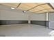 Well-organized garage with an epoxy floor and functional overhead door at 332 Aster Ridge Trl, Peachtree City, GA 30269
