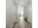 Upstairs hallway with wood floors and natural light at 332 Aster Ridge Trl, Peachtree City, GA 30269